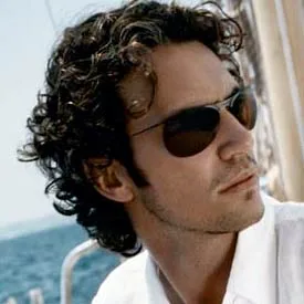 Man in tinted aviators on a sailboat