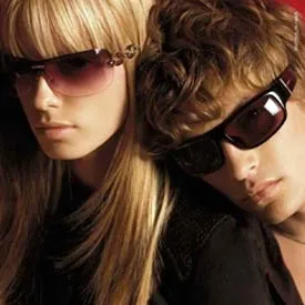 Two models in tinted sunglasses with decorative temples